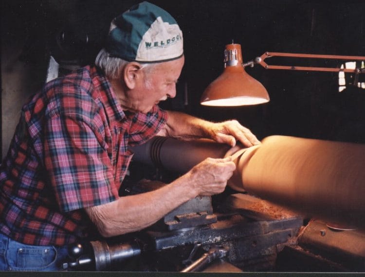 John Tompson turning a post on his home-made lathe. John was a tree planter at the nursery and involved with the preservation of the forest in the 1980s
